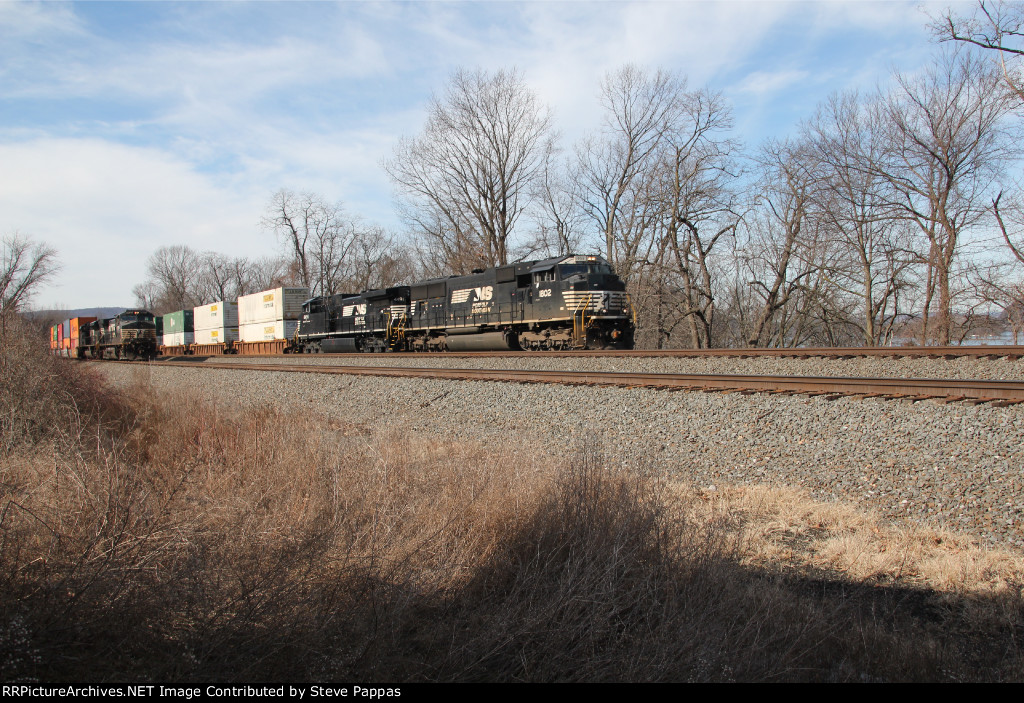 NS 1802 takes a train east at MP116